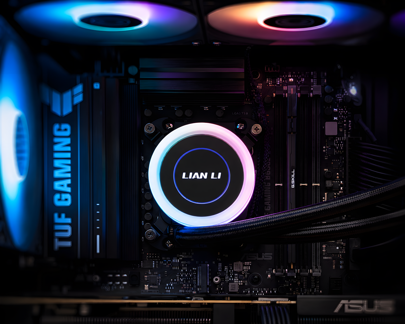 Valhalla Performance PC close-up featuring a Lian Li 360mm AIO liquid cooler, RGB case fans, ASUS TUF Gaming motherboard, and premium cable routing.