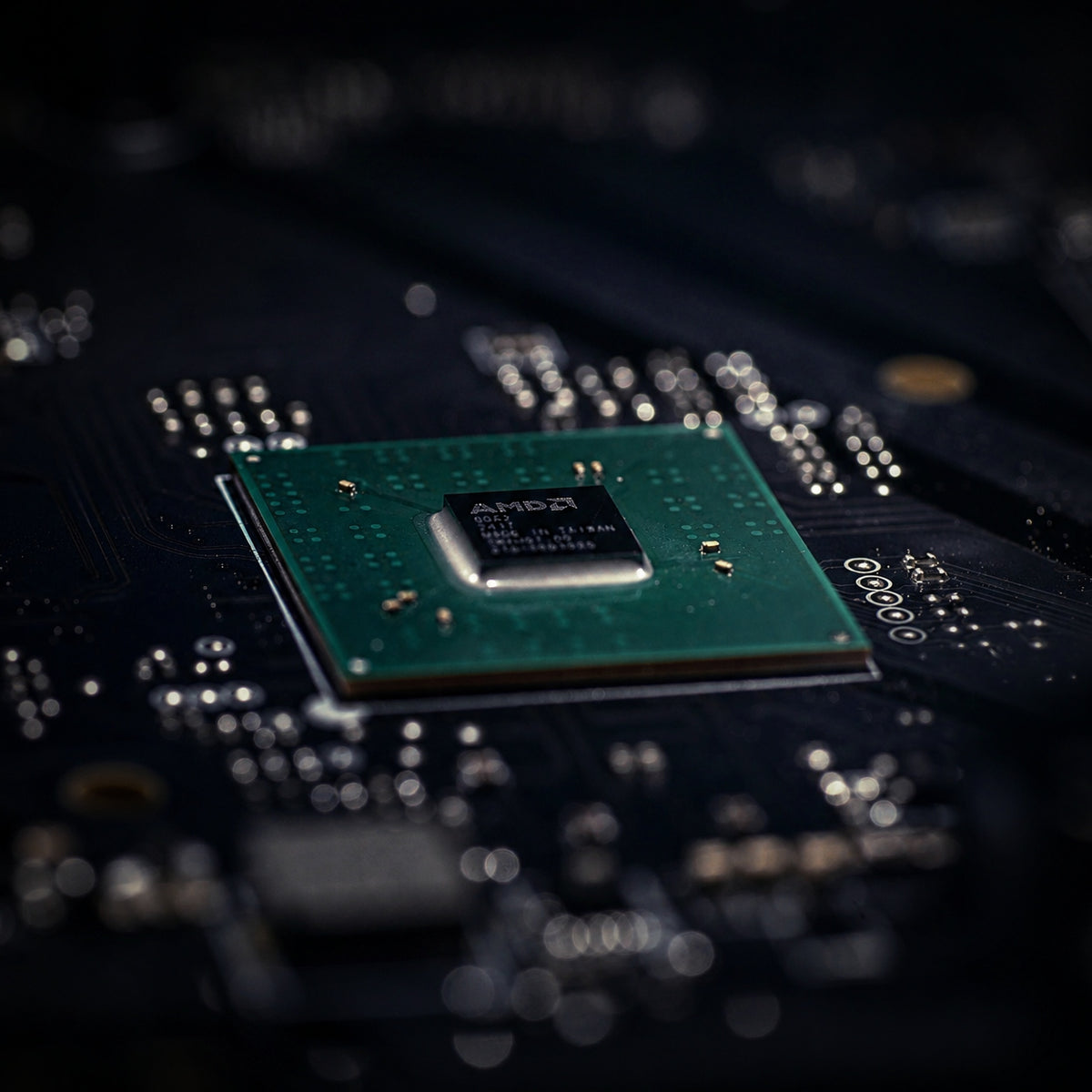 Close-up of an AMD X870 motherboard chipset for a Valhalla custom gaming PC build, showcasing premium desktop motherboard hardware, high-performance gaming computer components, and modern PC build engineering.