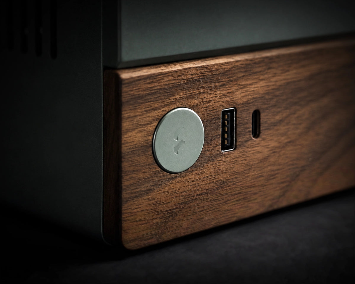 Close-up of a Fractal Design Terra aluminum and walnut wood PC case for a Valhalla custom SFF gaming PC, highlighting premium small form factor chassis design, real wood accents, compact gaming hardware, and modern desktop PC build quality.