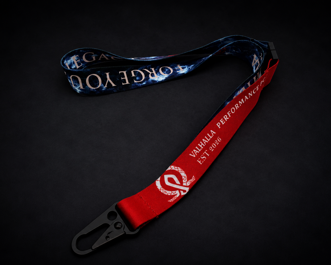Premium Valhalla Performance PC woven lanyard featuring Forge Your Legacy branding, red fabric strap, detachable black clasp, stormy mountain artwork, Nordic-inspired design, and custom gaming PC lifestyle merchandise.
