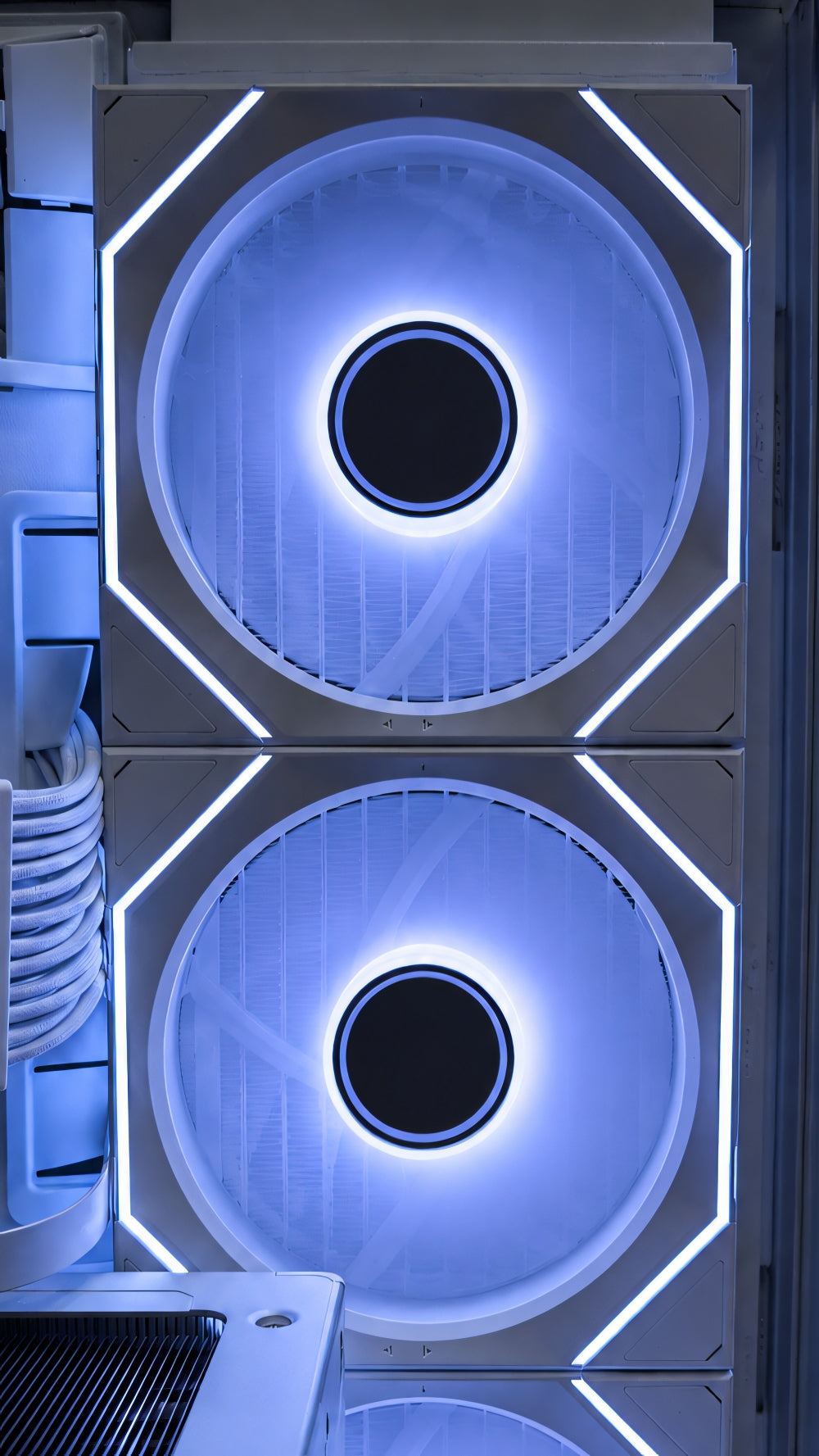 Close-up of premium RGB infinity mirror cooling fans inside the white Valhalla Thor Frostborn gaming PC.